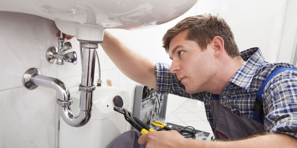Home service and repair; Plumber working on sink
